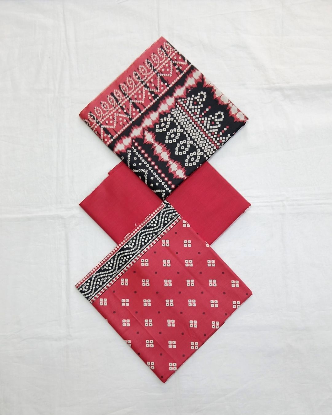 Red printed cotton 3pc suit with black dupatta by Ajwa Textiles